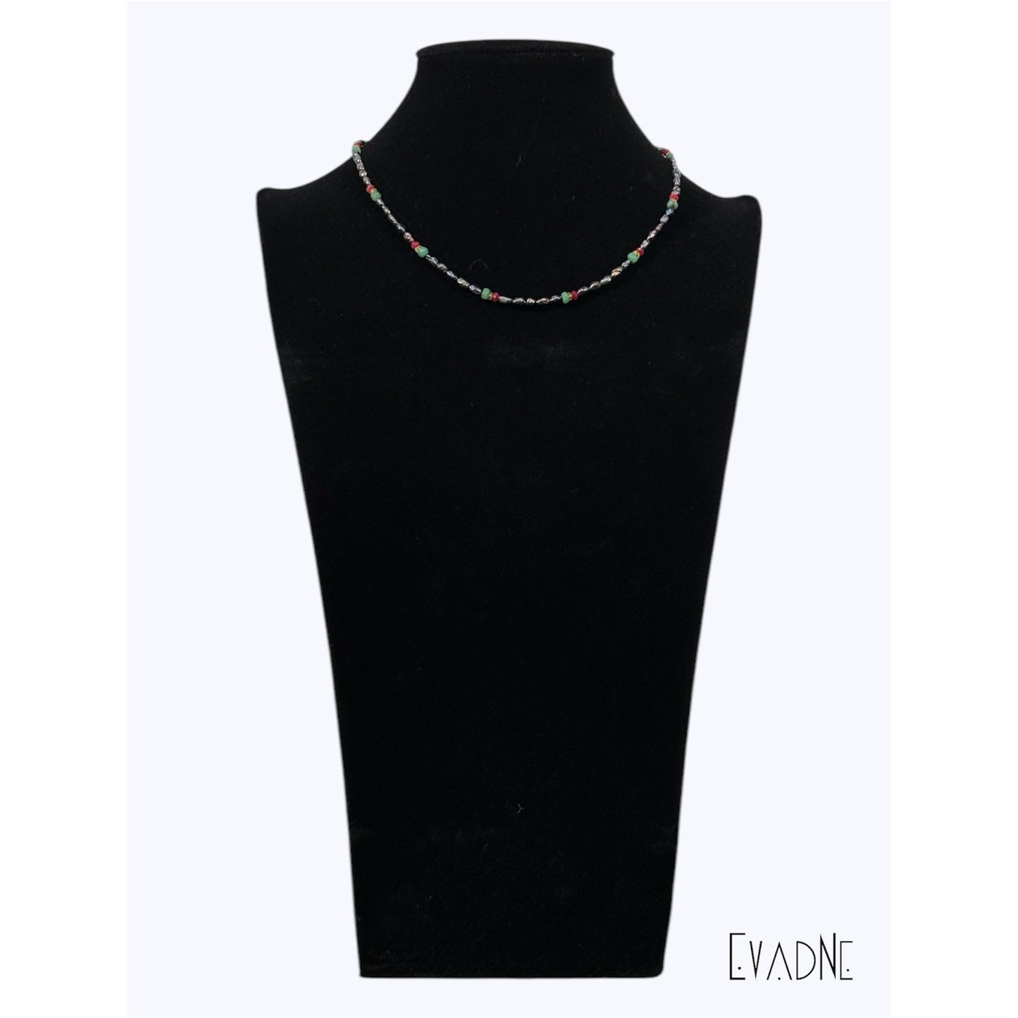 delicate black pearl necklace embellished with rubies emeralds and yellow sapphires