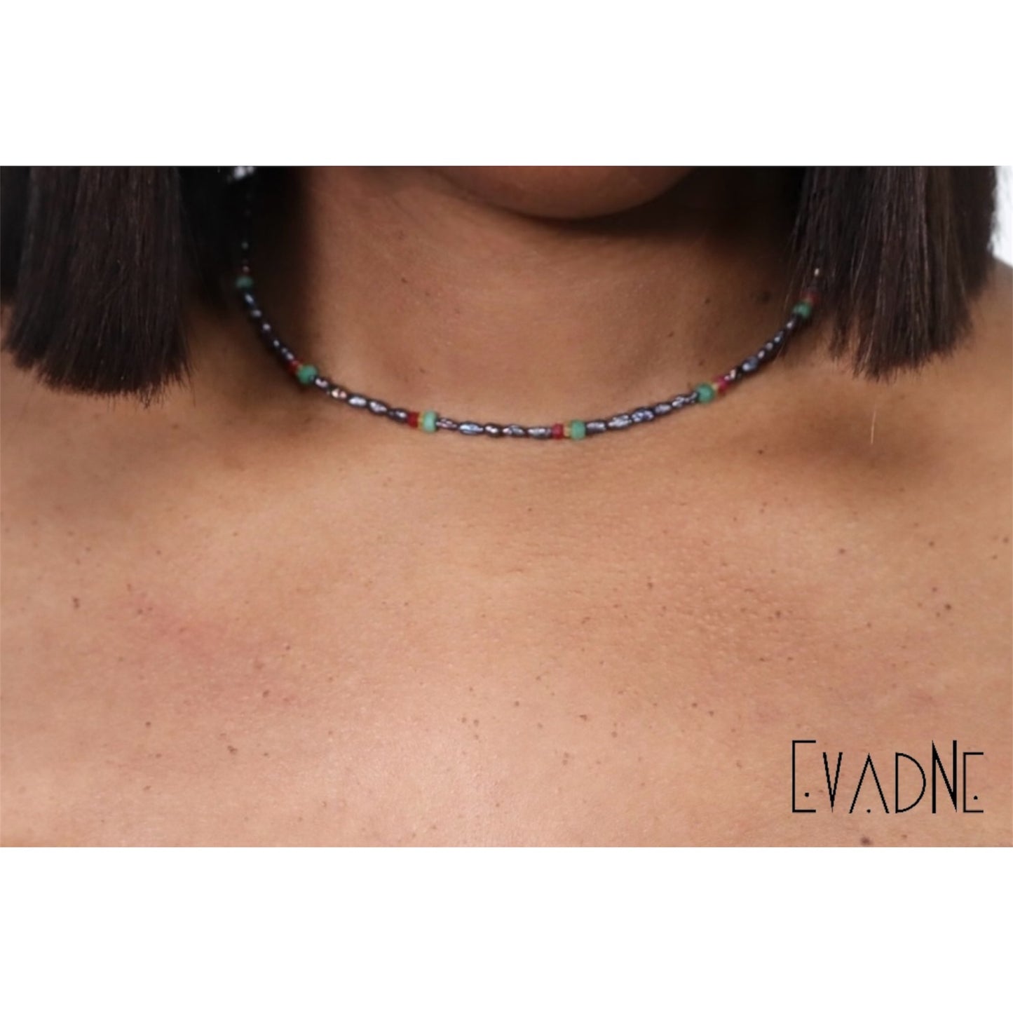 layered black pearl gemstone necklace worn at the collarbone
