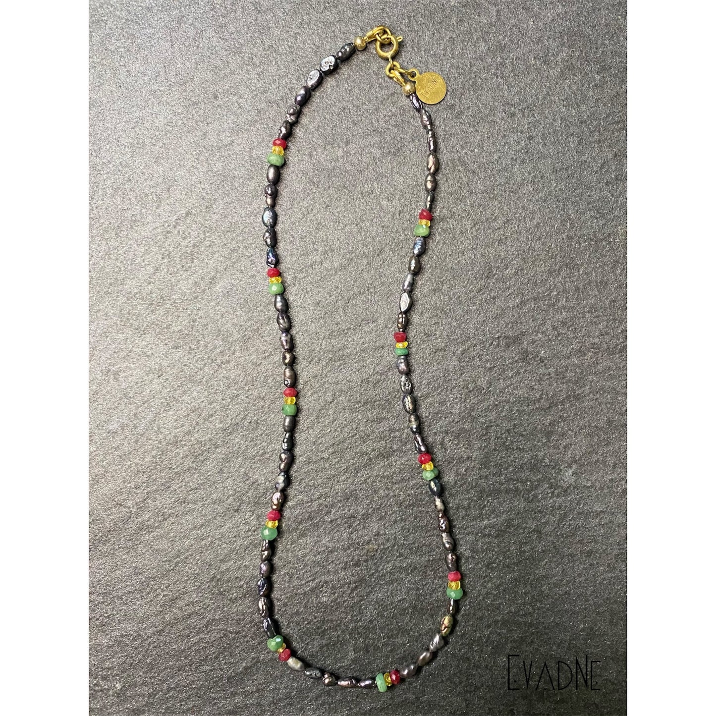 black Japanese rice pearl necklace with ruby emerald and sapphire accents