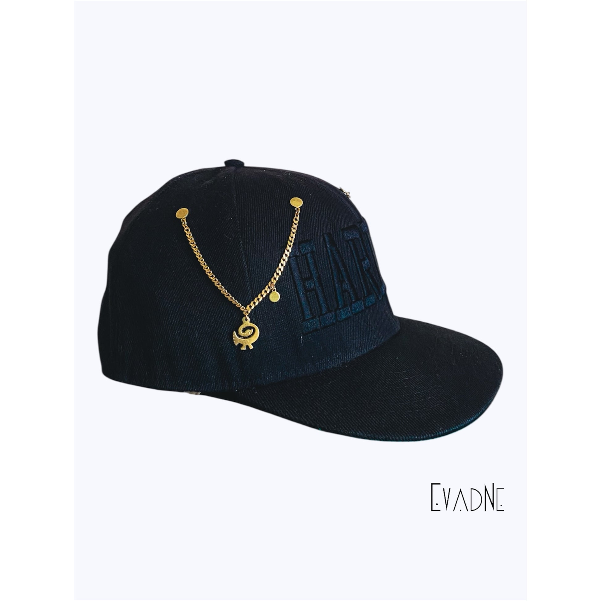 Detail of Sankofa charm on handcrafted brass hat pin chain