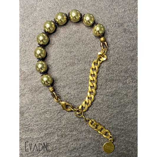 hematite bracelet with black brass bead caps and Cuban link chain