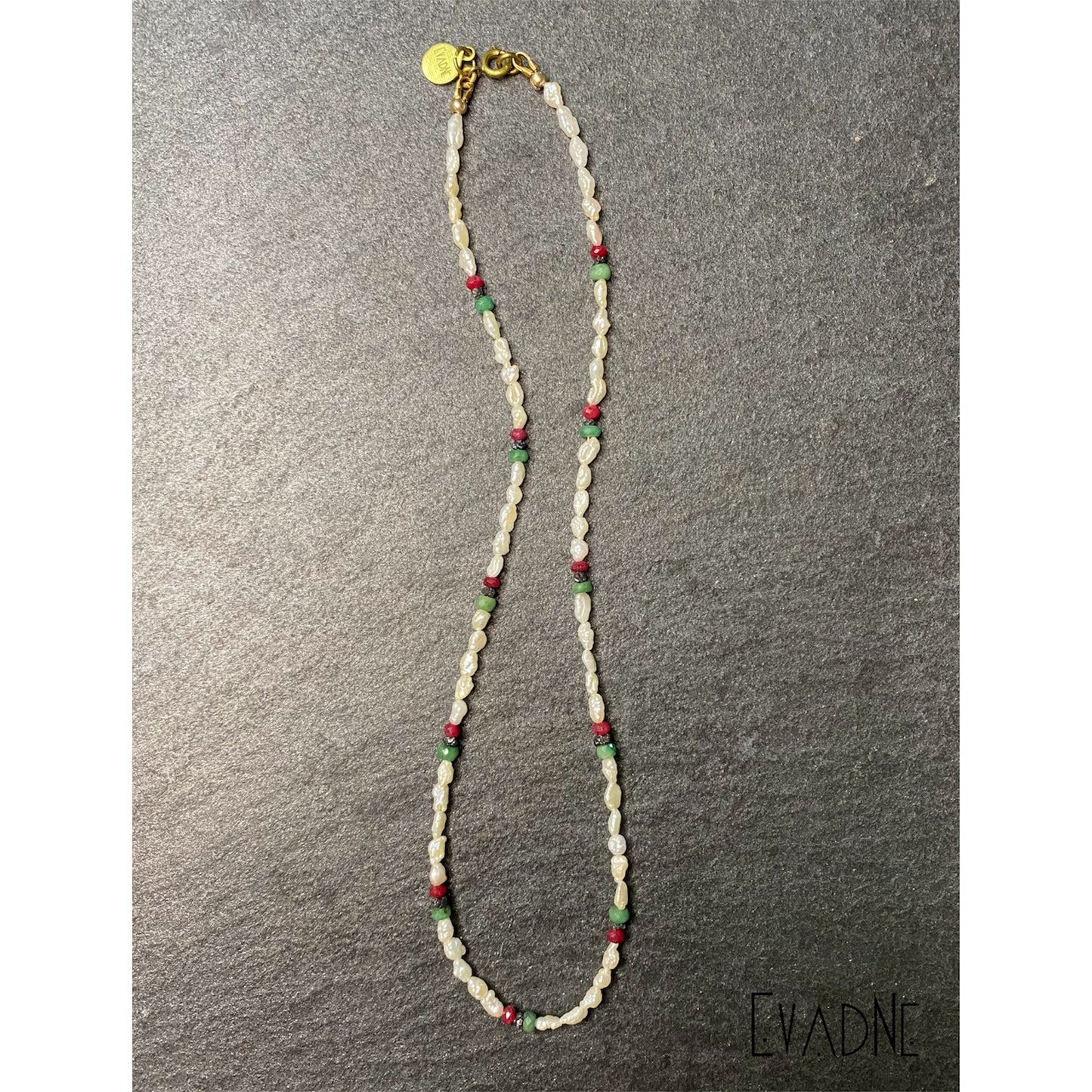 white Japanese rice pearl necklace with ruby emerald and black diamond accents