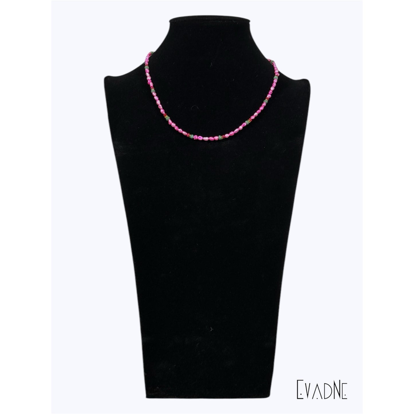 Layered pink pearl gemstone necklace worn at the collarbone