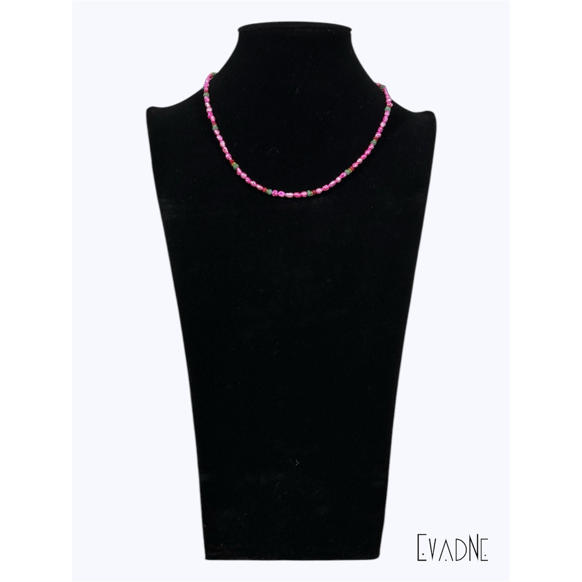 Layered pink pearl gemstone necklace worn at the collarbone