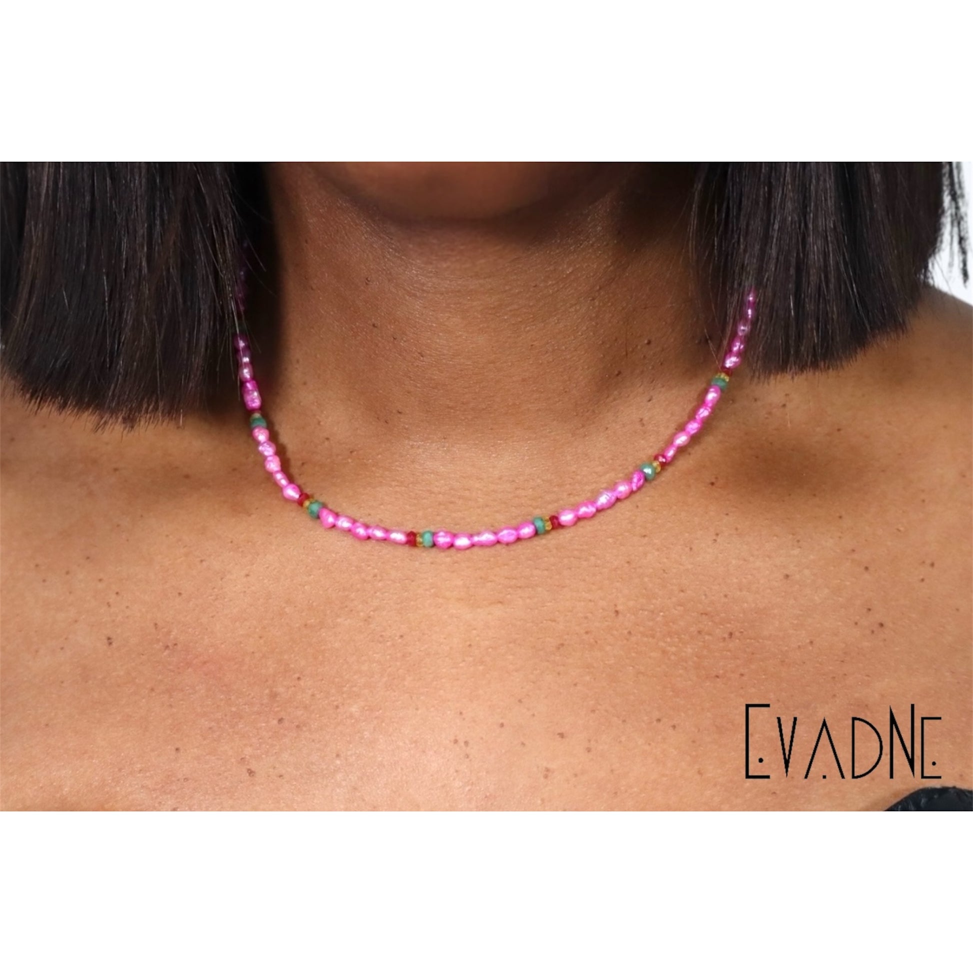 delicate pearl necklace embellished with rubies emeralds and yellow sapphires