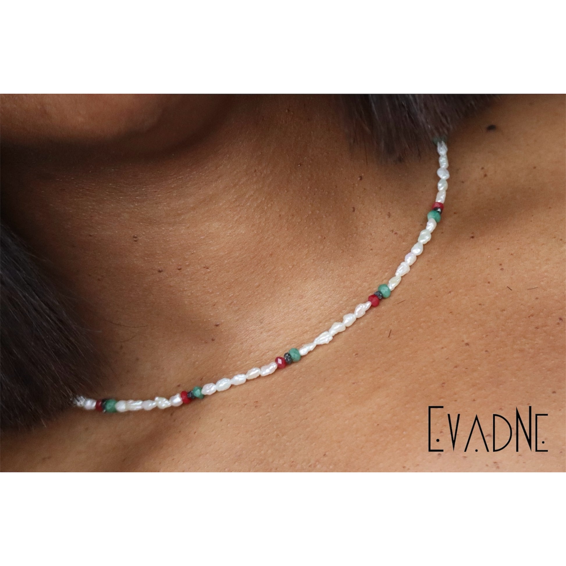 layered white pearl gemstone necklace worn at the collarbone