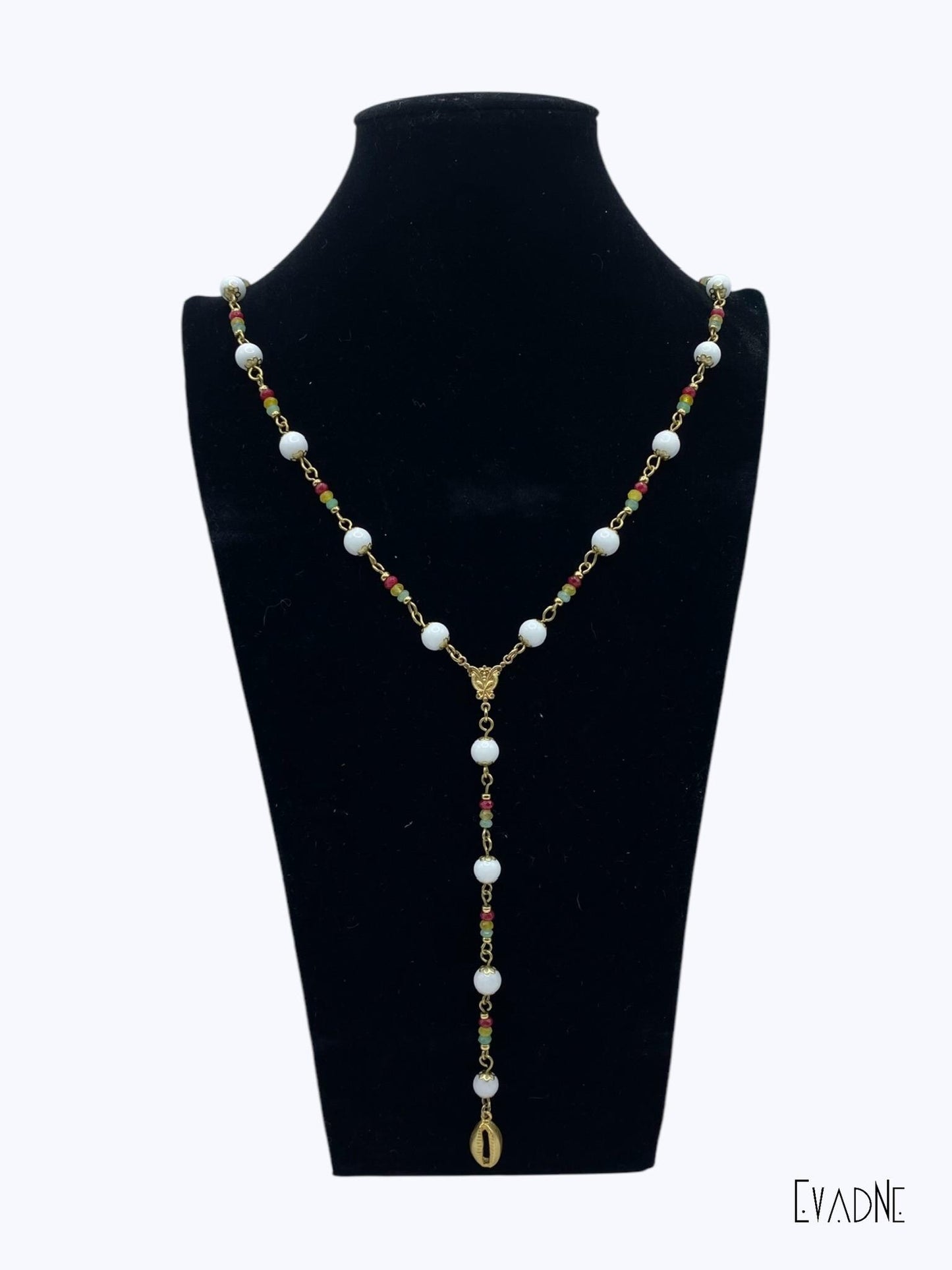 Rasta Rosary crafted with 8mm brass capped smooth white agate beads accentuated Rasta inspired jade gems and finished with brass links and cowrie shell charm.