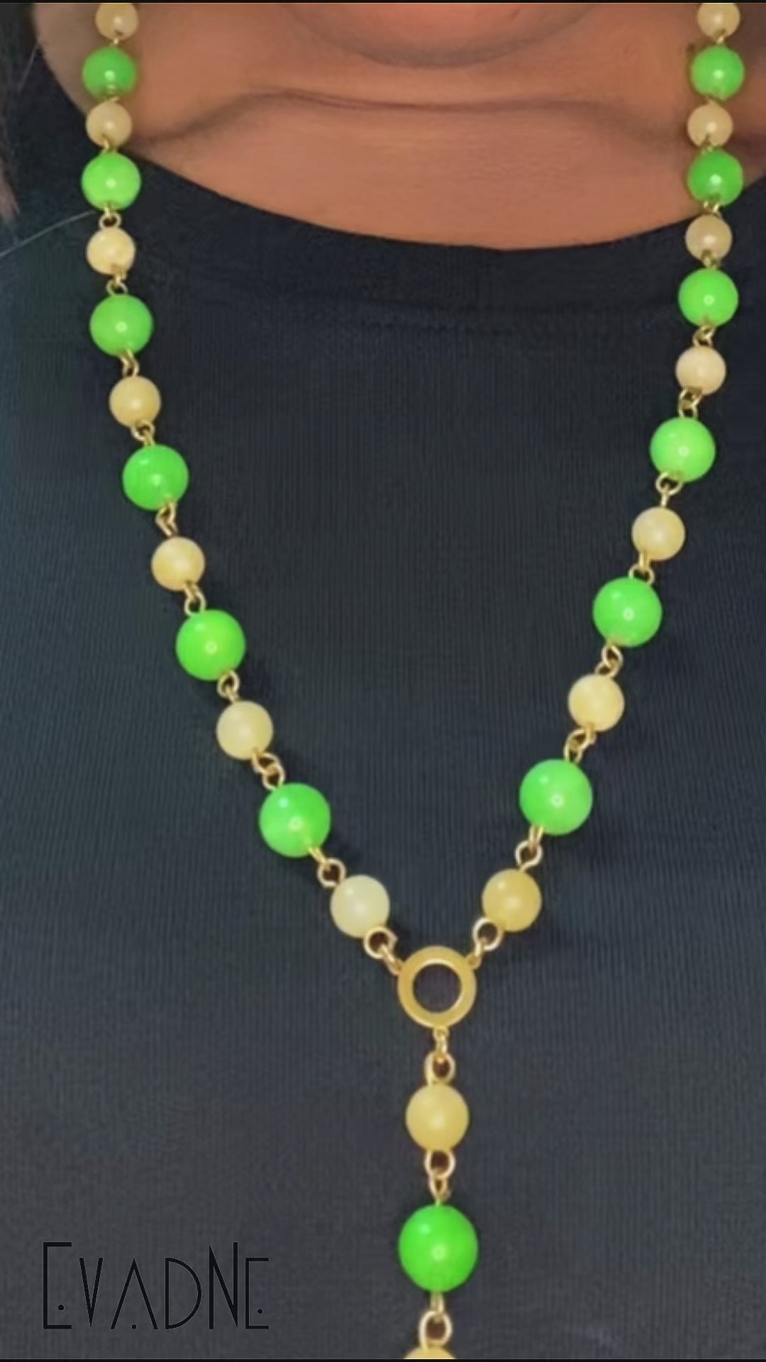green and yellow jade rosary necklace worn with Adinkra charm
