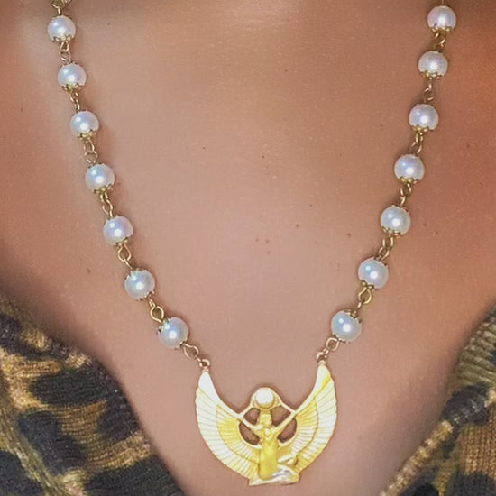 long pearl necklace with goddess charm worn as spiritual jewelry