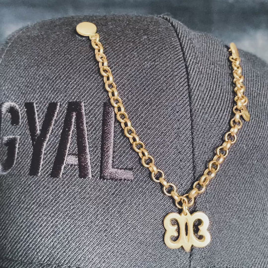 Detail of Hye Won Hye charm on handcrafted brass hat pin chain