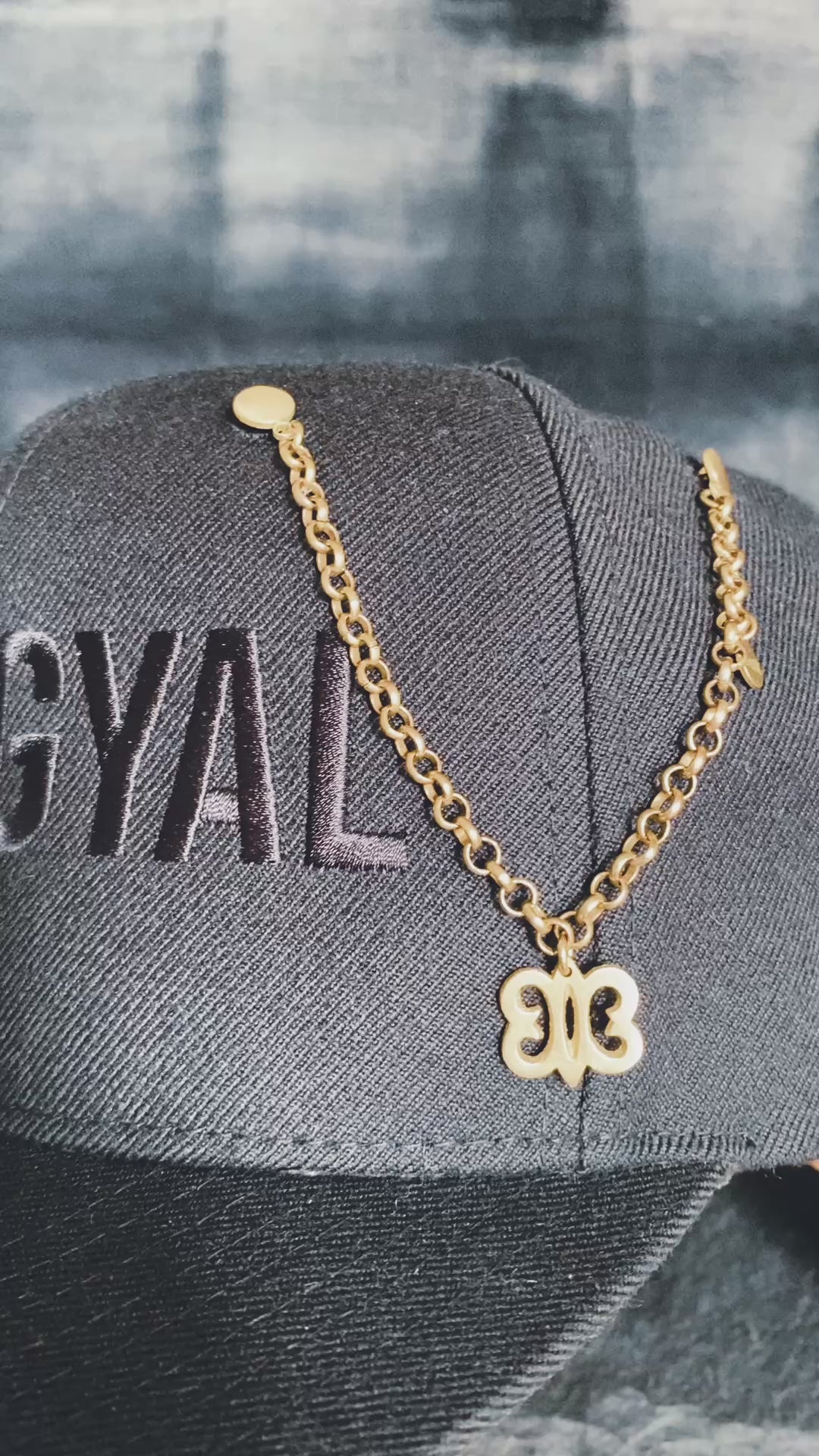 Detail of Hye Won Hye charm on handcrafted brass hat pin chain