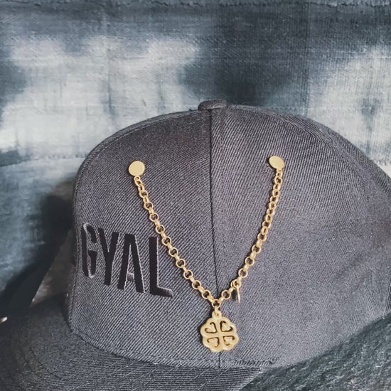 Adinkra symbol hat pin representing spiritual grounding and protection