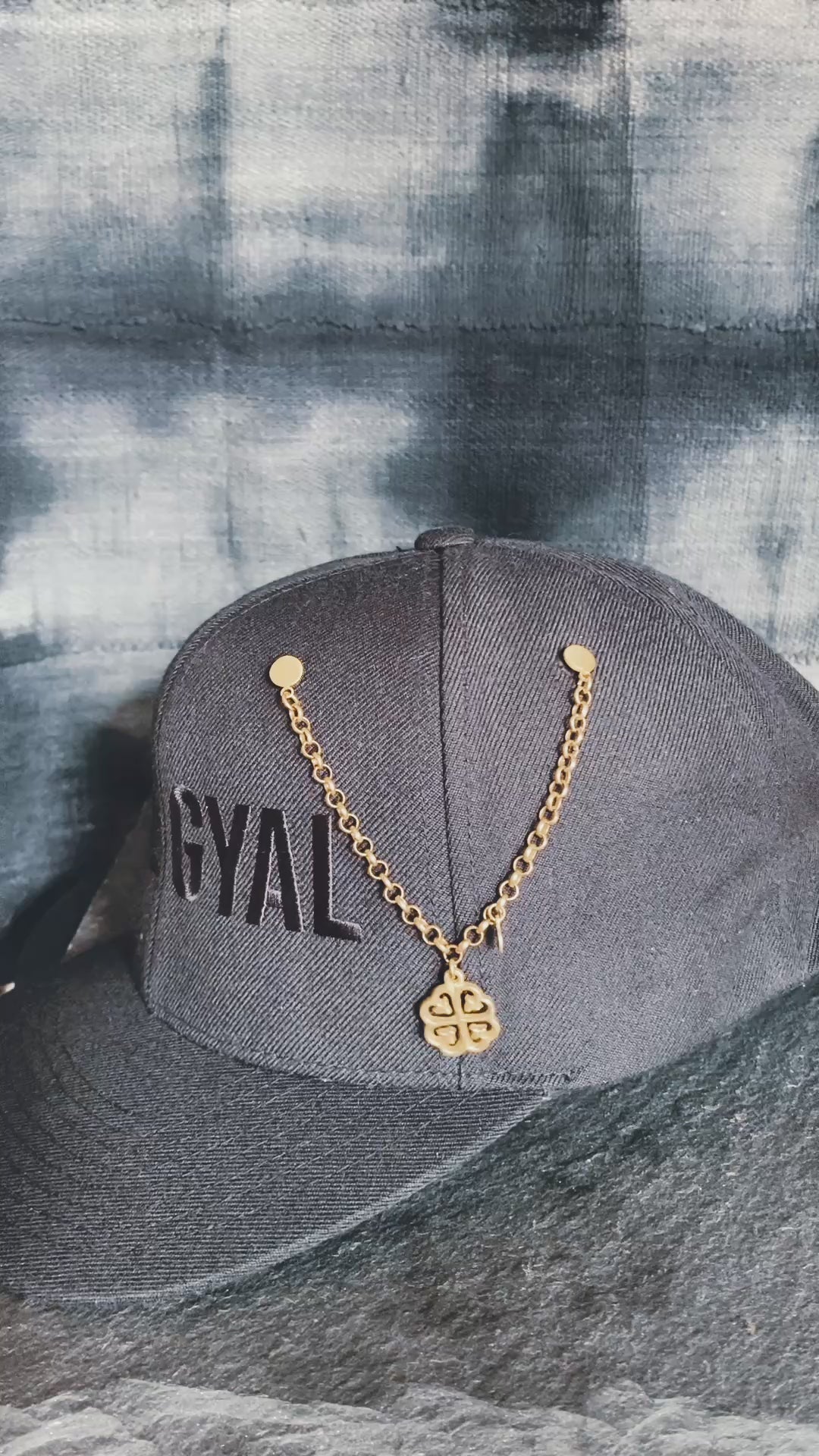 Adinkra symbol hat pin representing spiritual grounding and protection